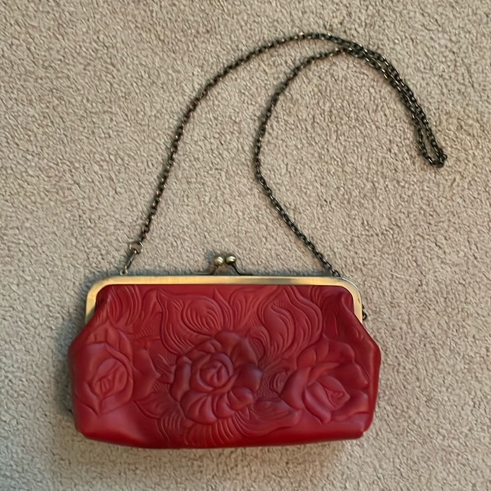 Patricia Nash red leather clutch with chain strap.